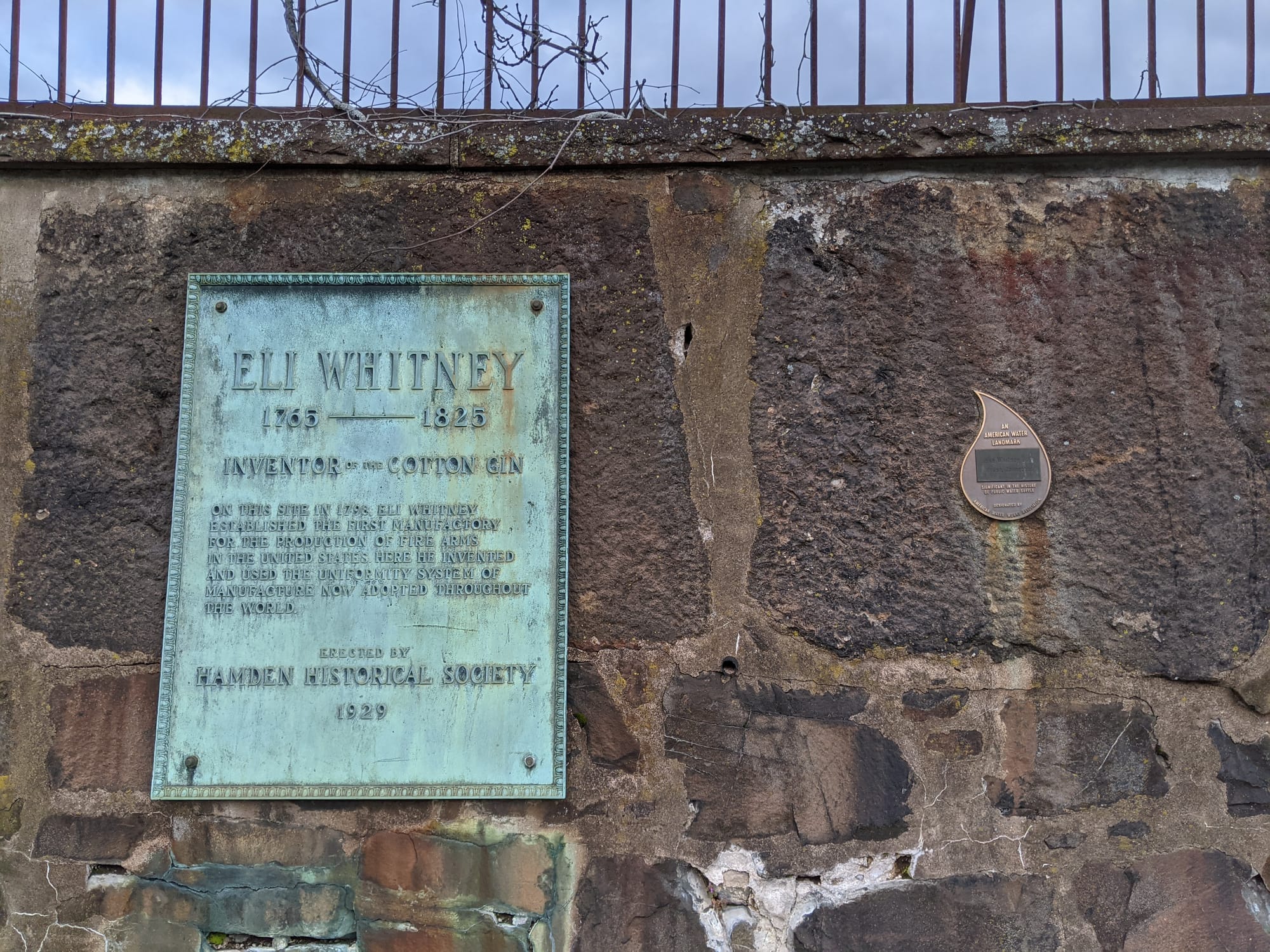 Eli Whitney 1765-1825 — bronze plaque, photographed on the trail