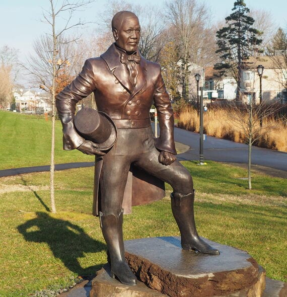 The statue of William Lanson on the Farmington Canal Trail, unveiled in 2020.